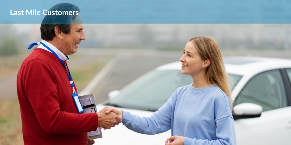 Two individuals in business attire shaking hands near a white car, with the text 