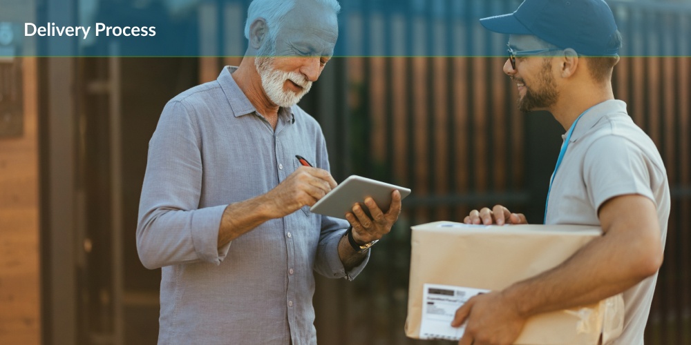 Two smiling men during a delivery process, one holding a tablet and the other holding a parcel