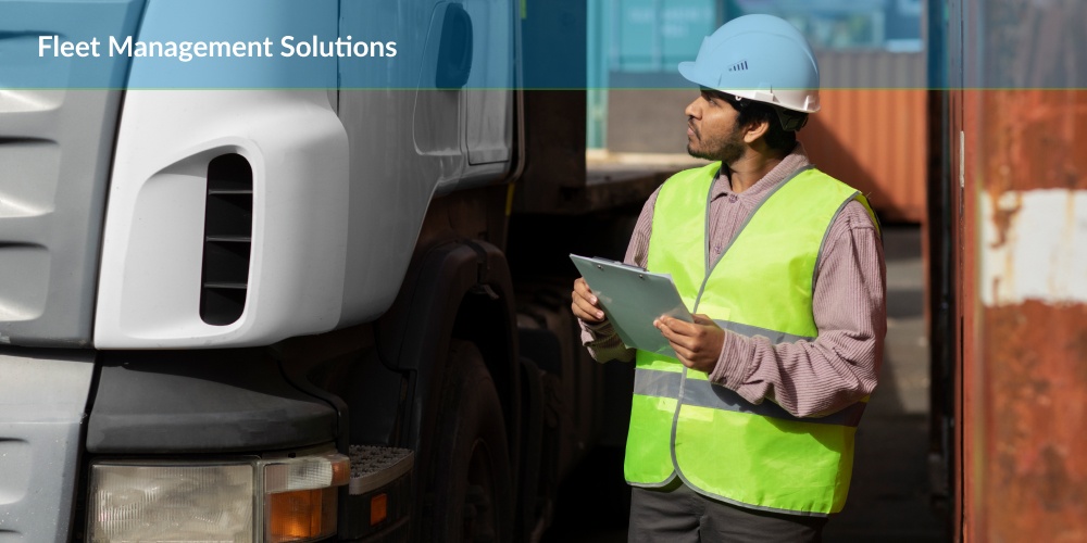 Fleet Management Solutions : a man in a safety vest standing next to a truck