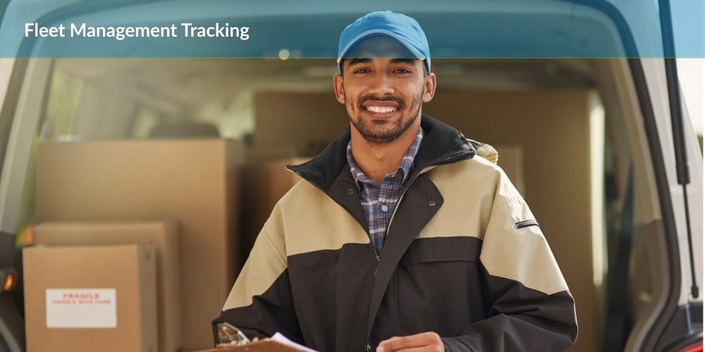 Man in hat smiling while using fleet management tracking software