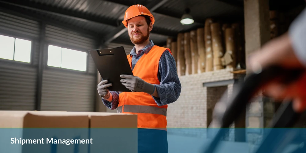 Employee overseeing shipment management with a clipboard in a storage facility