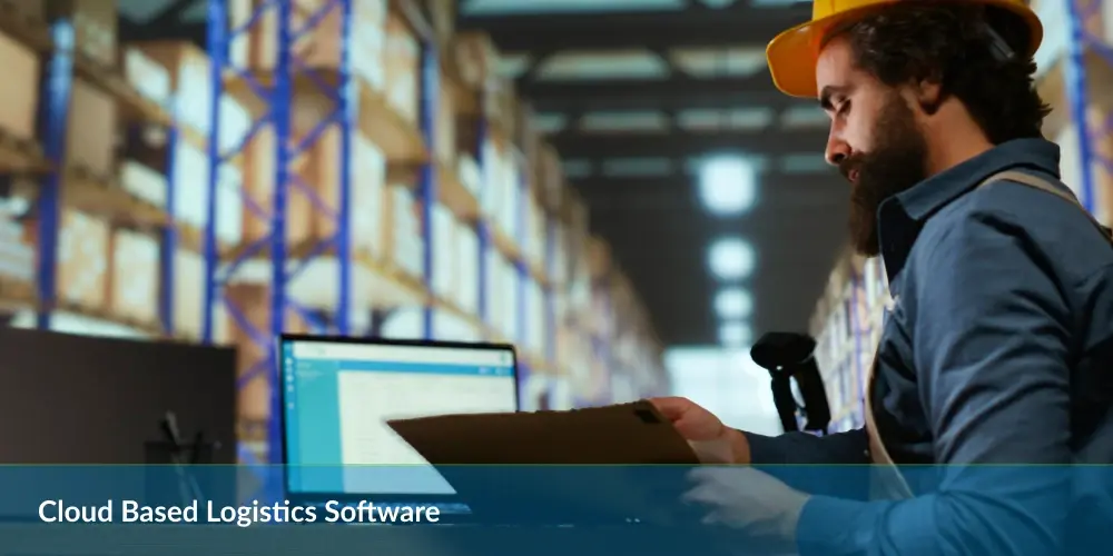 A worker in a warehouse with shelving, holding a clipboard, and a computer screen displaying "Cloud Based Logistics Software."