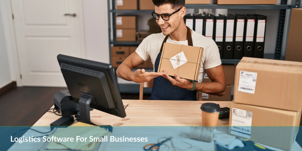 Logistics software for small business-a man holding a box in front of a computer