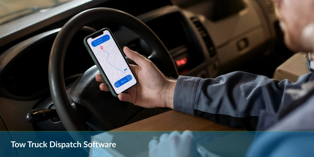 Driver in cab holding smartphone with map app, text below reads "Tow Truck Dispatch Software".