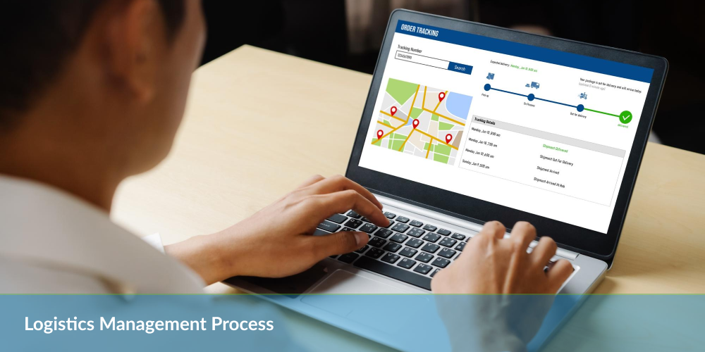 Individual working on a laptop displaying a logistics management process flowchart.