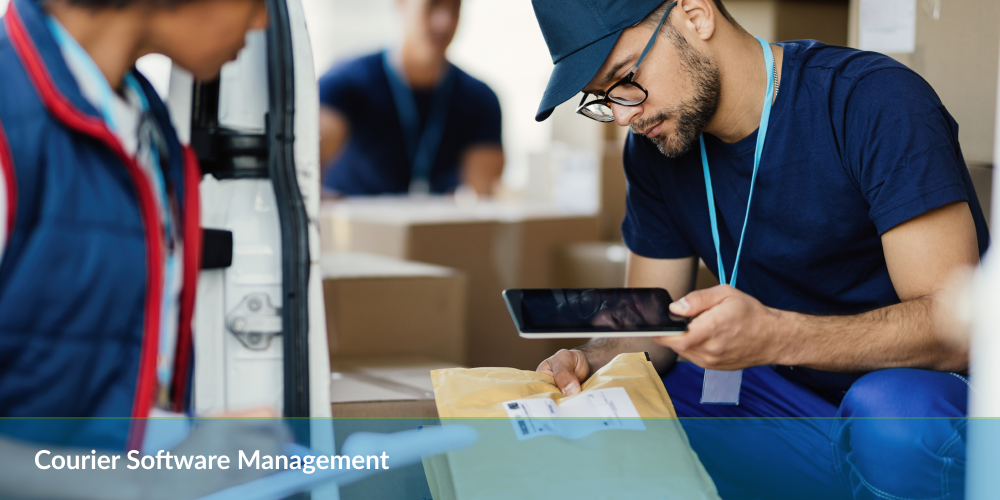 Courier software management: Delivery person scanning a package with a tablet for software management.