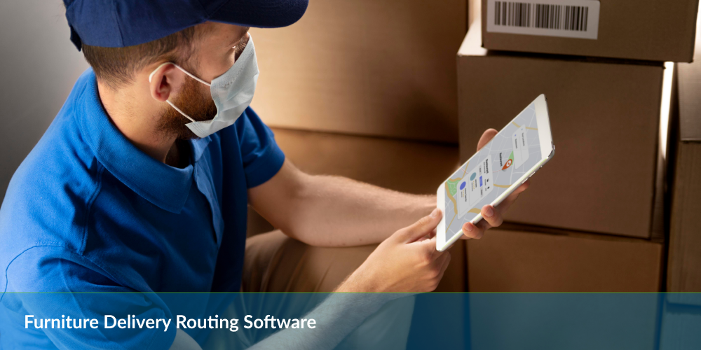 Furniture Delivery Routing Software: Delivery person in mask using a tablet with routing software, boxes in background.