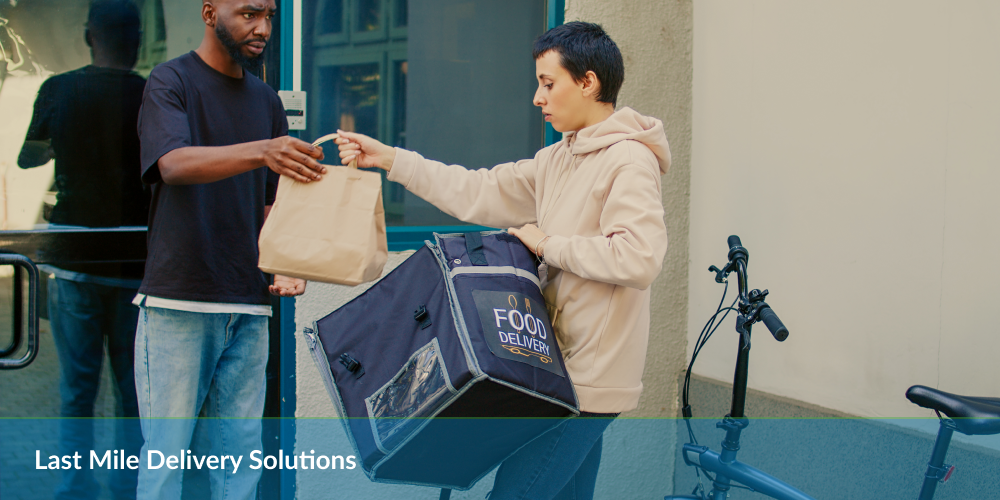 Last Mile Delivery Solutions : Delivery person handing a food bag to a customer next to a bicycle with delivery box.