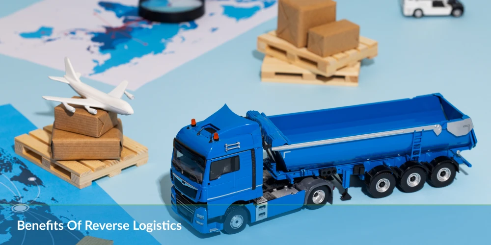 A blue toy truck beside wooden pallets and an airplane model on a map, illustrating reverse logistics concepts.